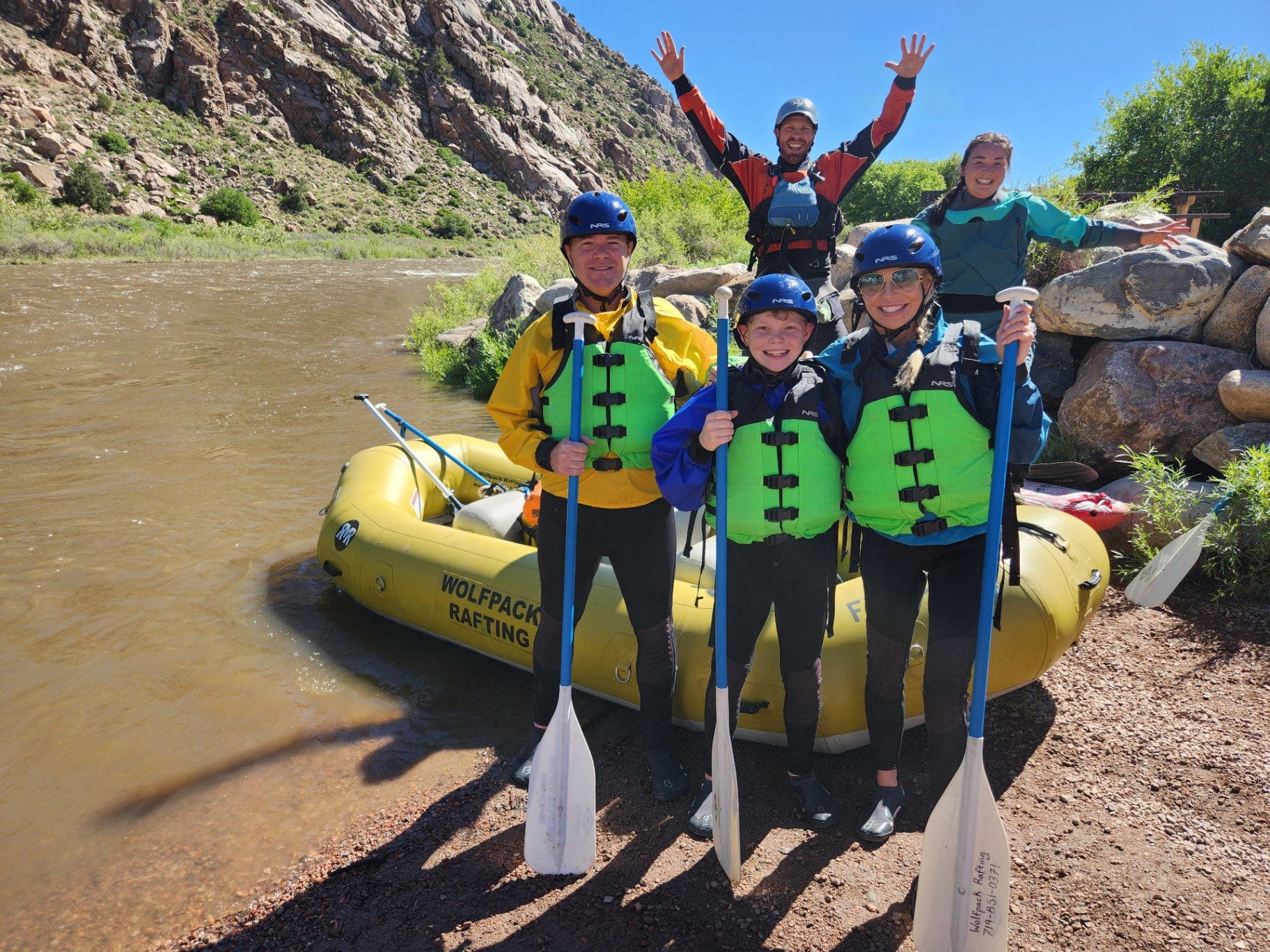Family posing with their Wolfpack guide before launching on the Arkansas River